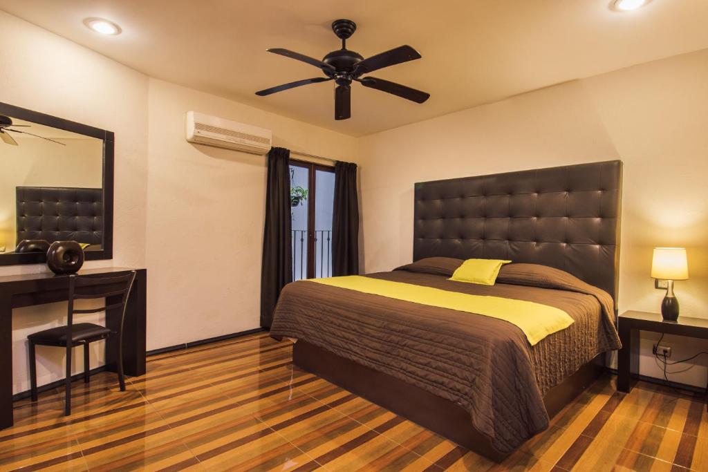 Postel nebo postele na pokoji v ubytování Hotel Majova Inn Xalapa