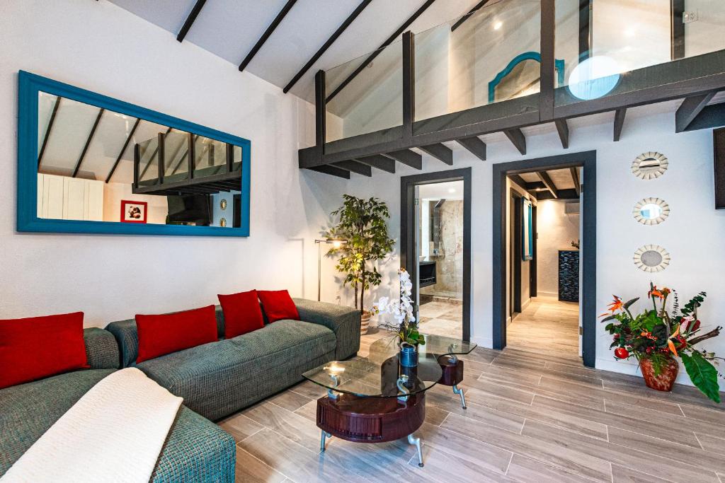 a living room with a couch and a table at Saunders 3BD Beach Cottage in Nassau