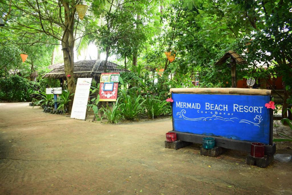 a sign for a memorial beach resort in a park at Mermaid Beach Resort in Dhoāpālong