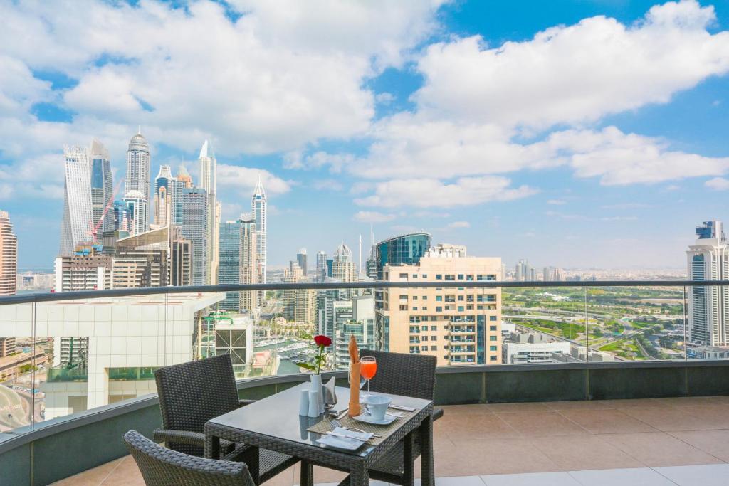 a restaurant with a view of the city at City Premiere Marina Hotel Apartments in Dubai