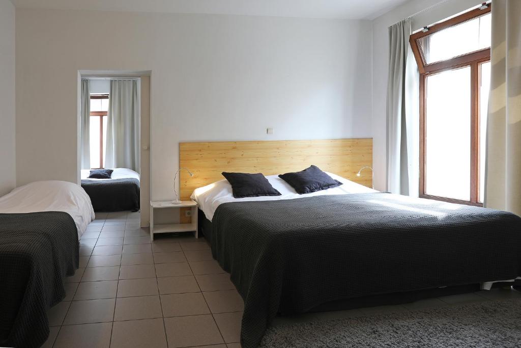 Postel nebo postele na pokoji v ubytování Hotel De Loft