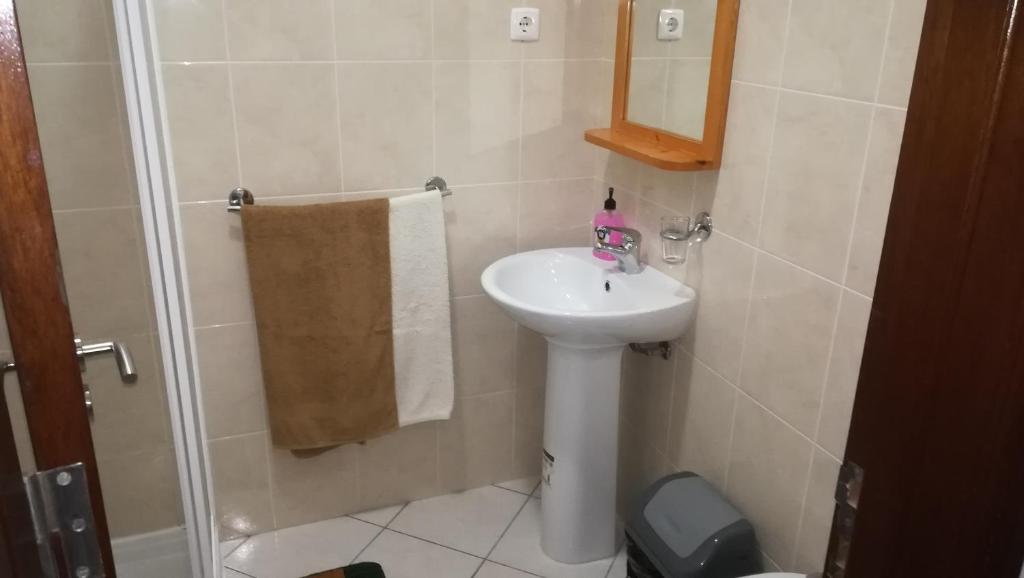 Koupelna v ubytování Basic Hotel