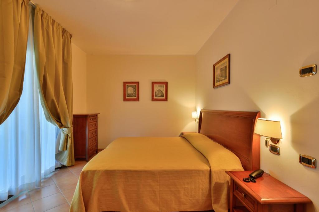 Łóżko lub łóżka w pokoju w obiekcie Minerva Resort Hotel