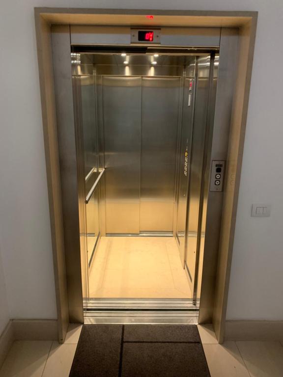 an elevator in a building with its door open at Berga Exclusive Suite 3 in Bari