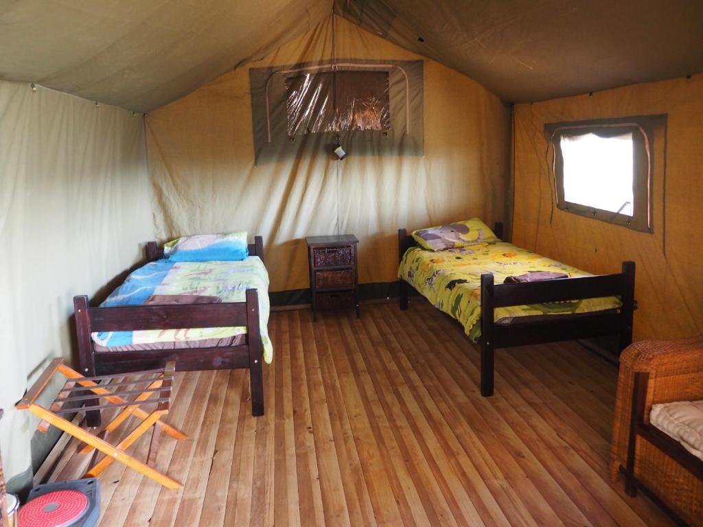 Postel nebo postele na pokoji v ubytování Pure Nature Familodge