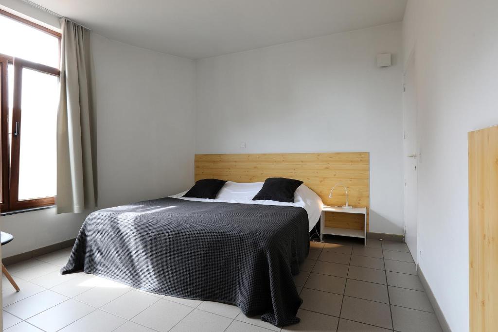 Postel nebo postele na pokoji v ubytování Hotel De Loft
