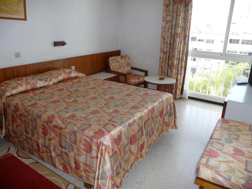 Postel nebo postele na pokoji v ubytování HOTEL KAMAL CITY CENTER