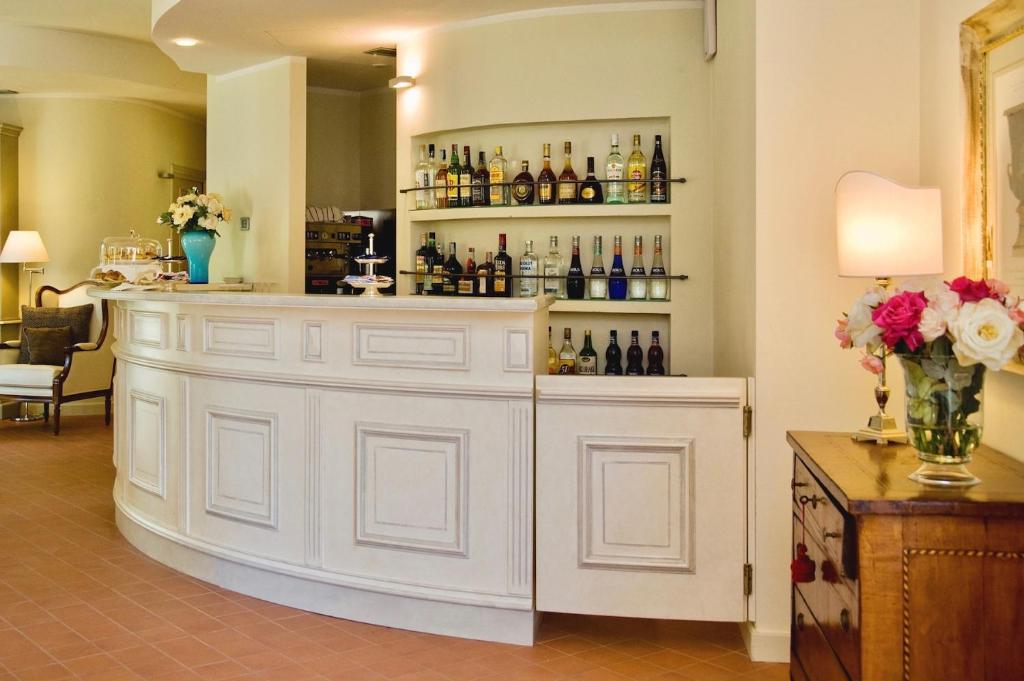 a large white bar with bottles on the wall at Villa Agnese in Sestri Levante