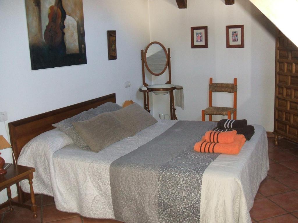 a bedroom with a bed with two pillows on it at CASA GRACIANO I in Ochagavía