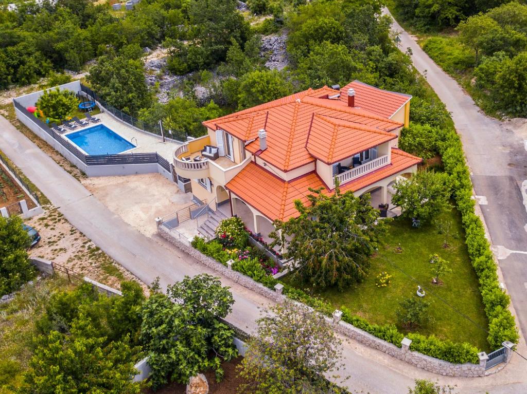 an overhead view of a house with an orange roof at Villa &quot;Mile&quot; in Katuni