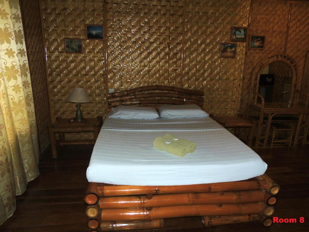 Postel nebo postele na pokoji v ubytování Coral Cay Resort, Inc.