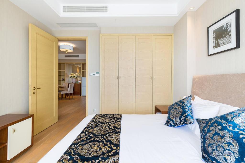 Ein Bett oder Betten in einem Zimmer der Unterkunft Pinxiayuan Apartment in Lvcheng Resort
