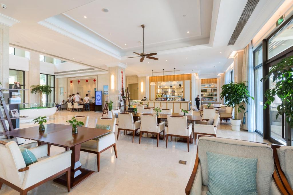 Ein Sitzbereich in der Unterkunft Pinxiayuan Apartment in Lvcheng Resort