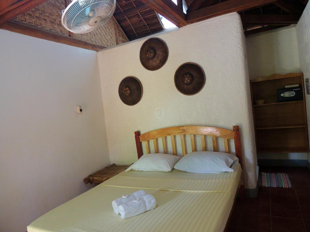 Postel nebo postele na pokoji v ubytování Coral Cay Resort, Inc.