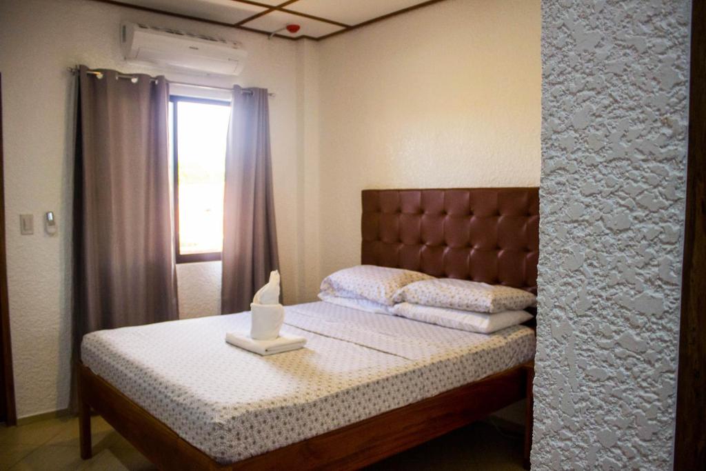 Postel nebo postele na pokoji v ubytování Sunville Hotel and Restaurant