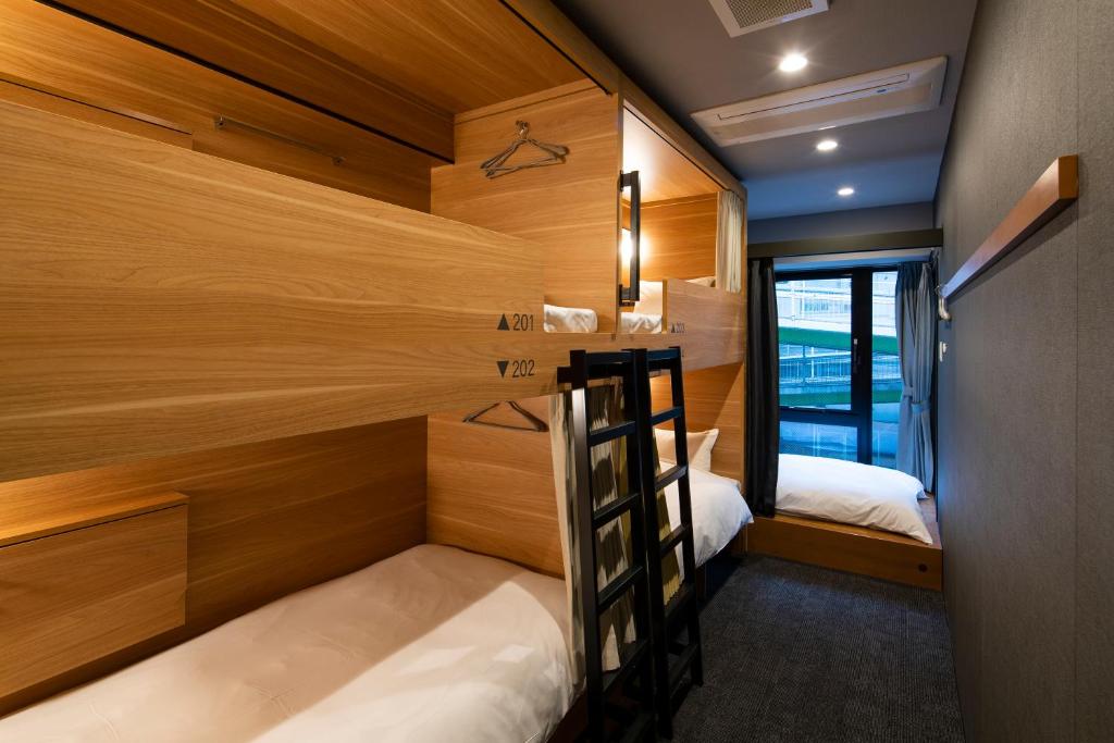 Postel nebo postele na pokoji v ubytování Grids Tokyo Ueno Hotel&Hostel
