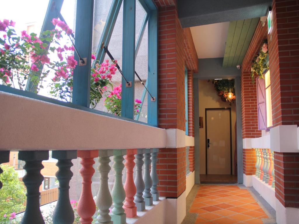 a building with a balcony and a door at DG Hotel in Taipei