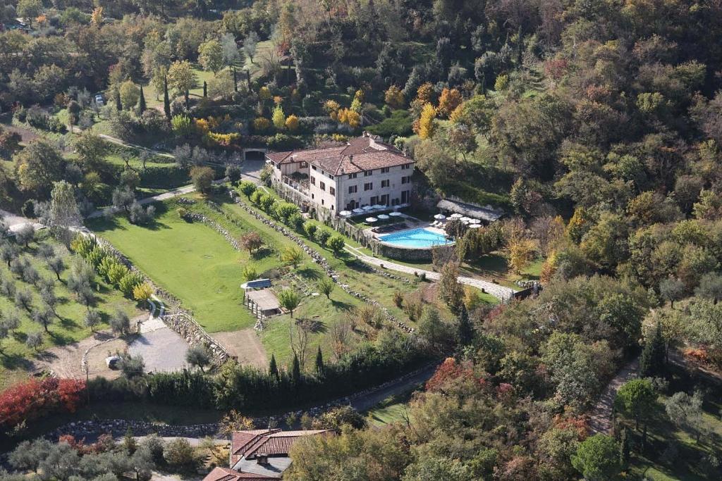 an aerial view of a house with a swimming pool at Villa Arcadio in Salò