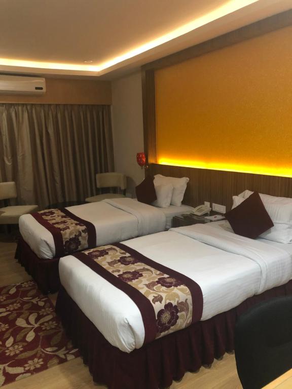 Postel nebo postele na pokoji v ubytování Hotel Harrison Palace