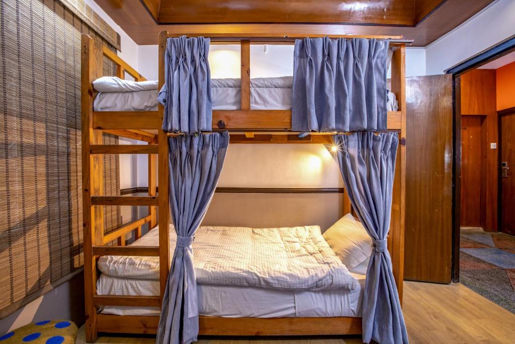 Postel nebo postele na pokoji v ubytování Shangrila Boutique Hotel