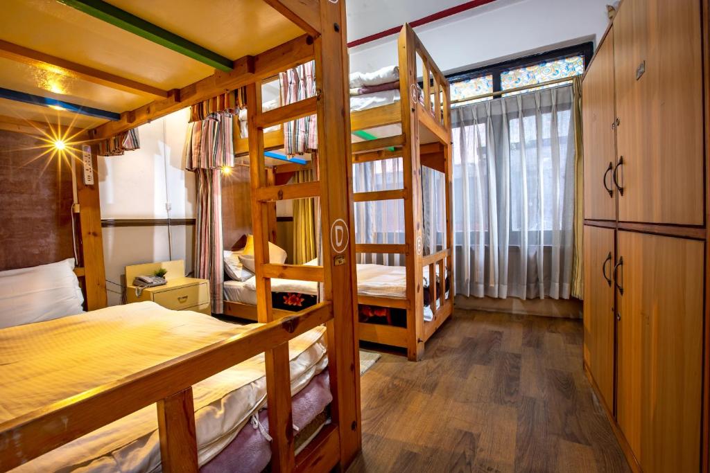 Postel nebo postele na pokoji v ubytování Shangrila Boutique Hotel