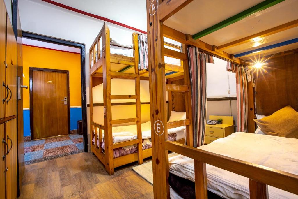 Postel nebo postele na pokoji v ubytování Shangrila Boutique Hotel