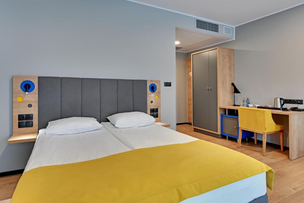 Postel nebo postele na pokoji v ubytování HOTEL NUMBER ONE BY GRANO Gdańsk - GRANO LIFE Gdańsk