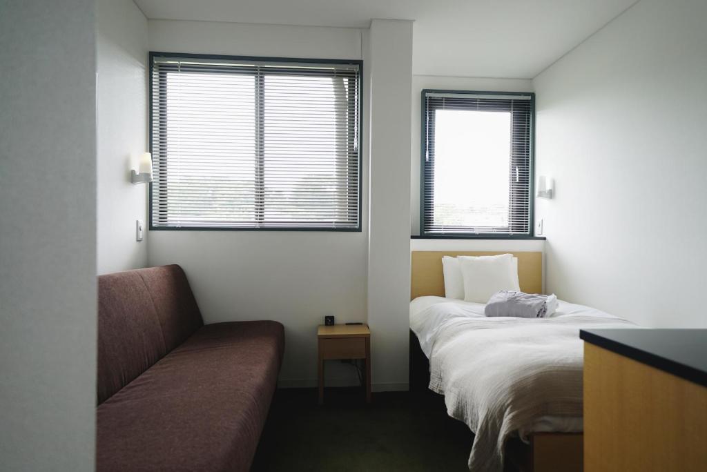 Postel nebo postele na pokoji v ubytování sararaso