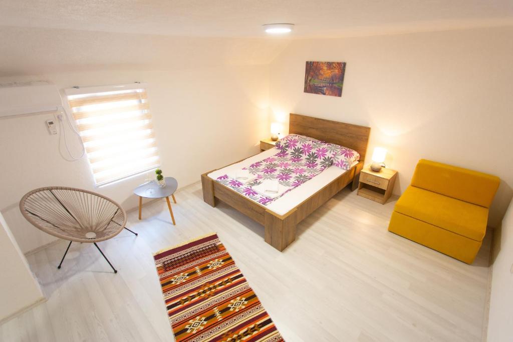 Postel nebo postele na pokoji v ubytování Apartments Daris