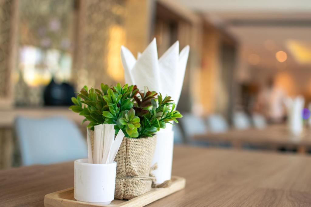 A floral table arrangement decorates a softly lit hotel interior.