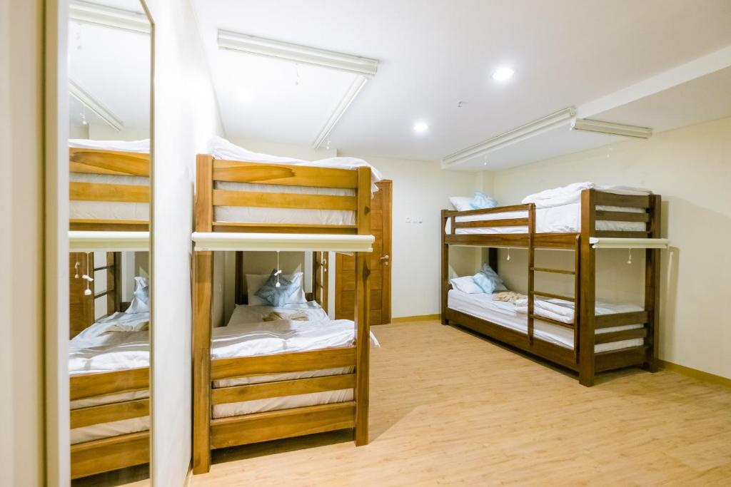Postel nebo postele na pokoji v ubytování Caroline Hostel
