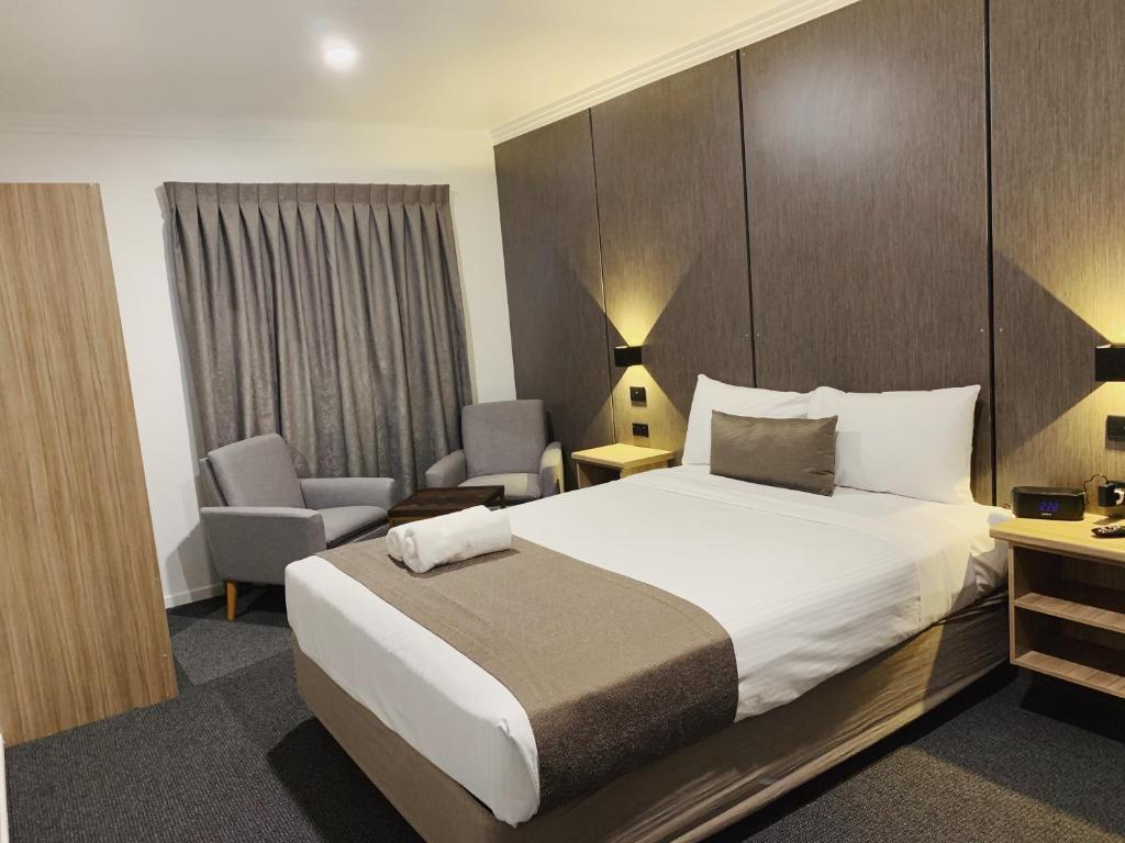Postel nebo postele na pokoji v ubytování Huskisson Beach Motel