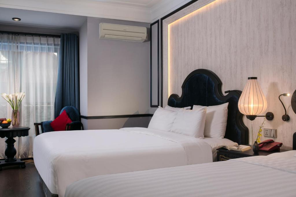 Postel nebo postele na pokoji v ubytování La Beaute Boutique Hotel & Spa