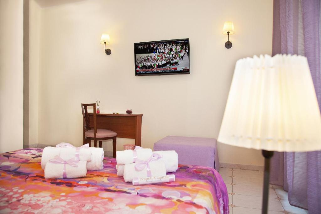 Posteľ alebo postele v izbe v ubytovaní b&b Napoli Capitale