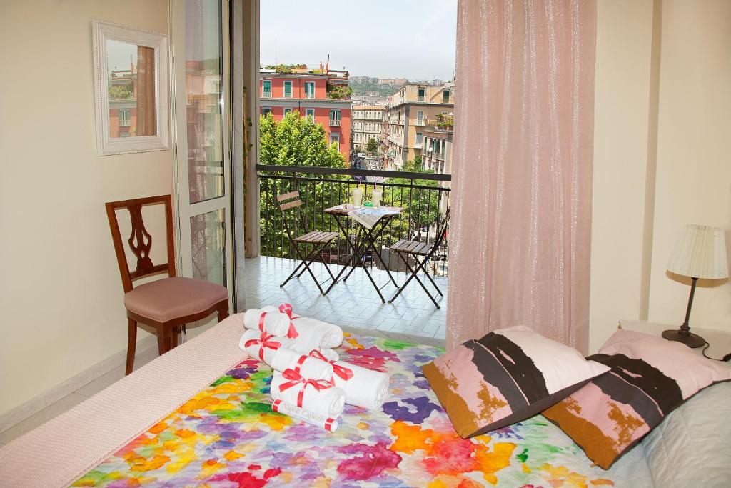 Posteľ alebo postele v izbe v ubytovaní b&b Napoli Capitale