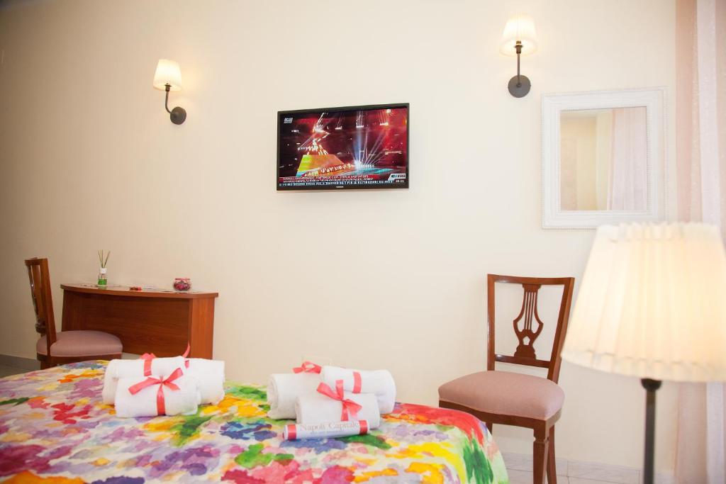 Posteľ alebo postele v izbe v ubytovaní b&b Napoli Capitale