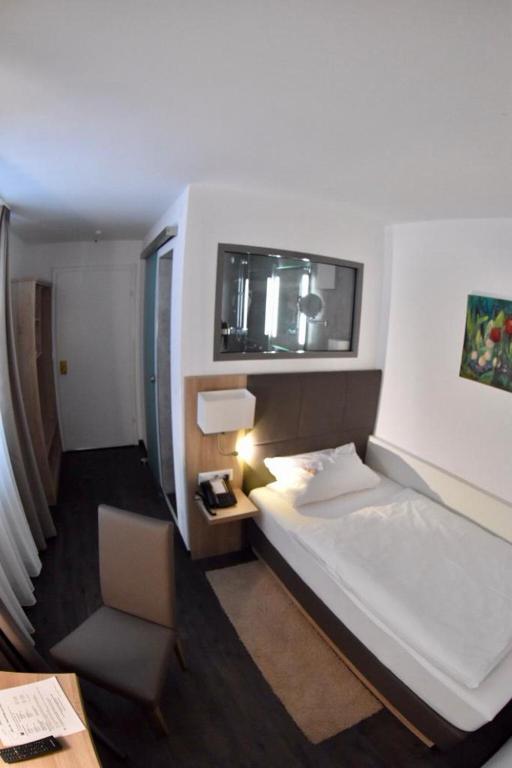 Postel nebo postele na pokoji v ubytování Hotel Hamann