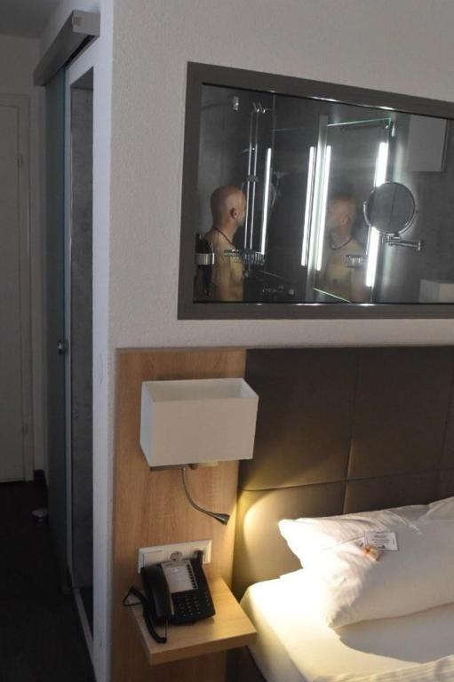 Postel nebo postele na pokoji v ubytování Hotel Hamann