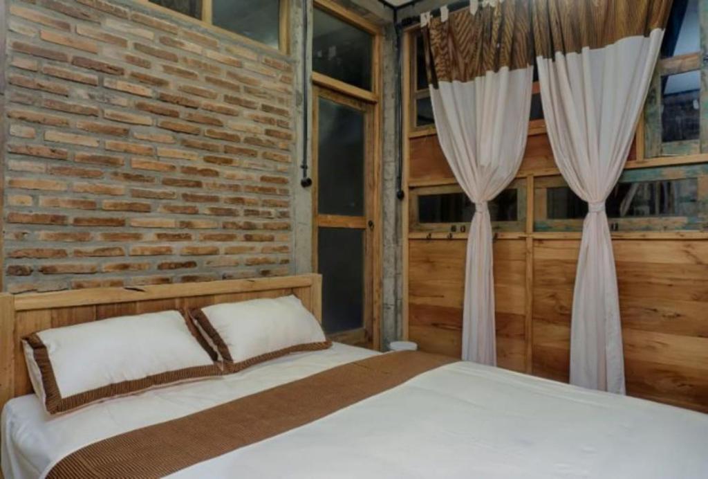 Postel nebo postele na pokoji v ubytování Lorong Homestay
