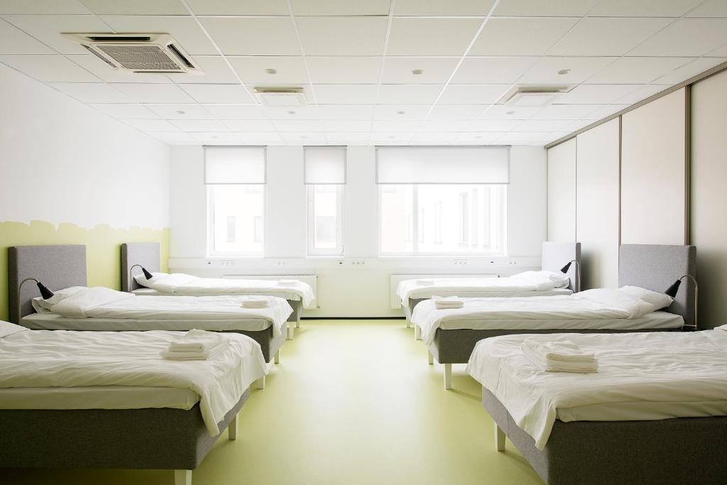Postel nebo postele na pokoji v ubytování Neotel