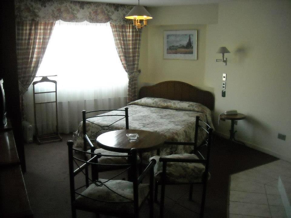 Postel nebo postele na pokoji v ubytování Hotel Quinchamali