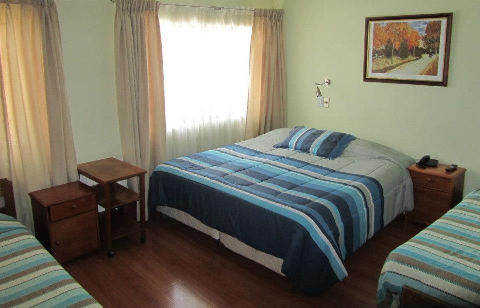 Postel nebo postele na pokoji v ubytování Hotel Quinchamali