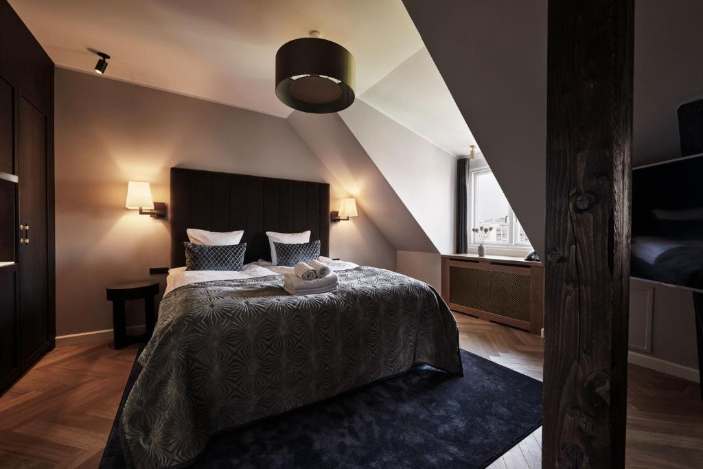 Postel nebo postele na pokoji v ubytování Ascot Hotel