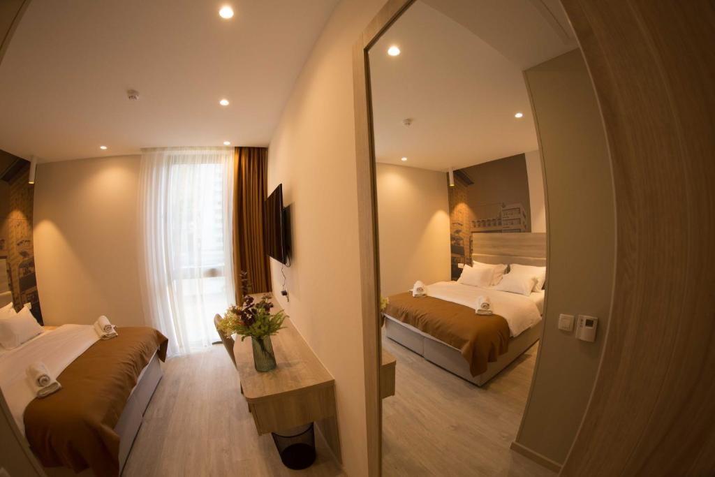 Postel nebo postele na pokoji v ubytování Hotel Verso
