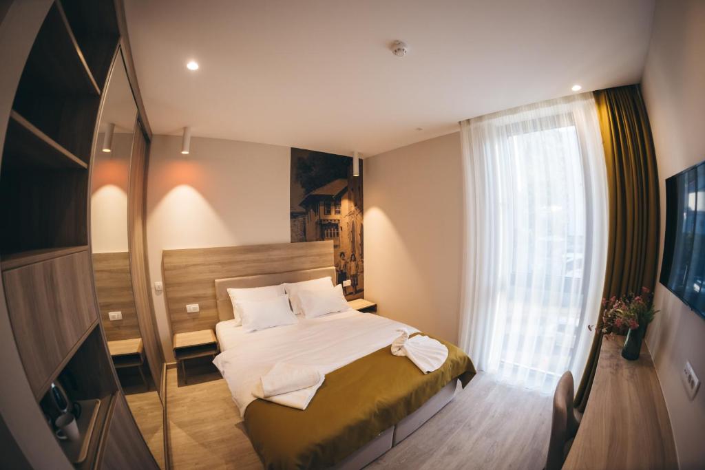 Postel nebo postele na pokoji v ubytování Hotel Verso