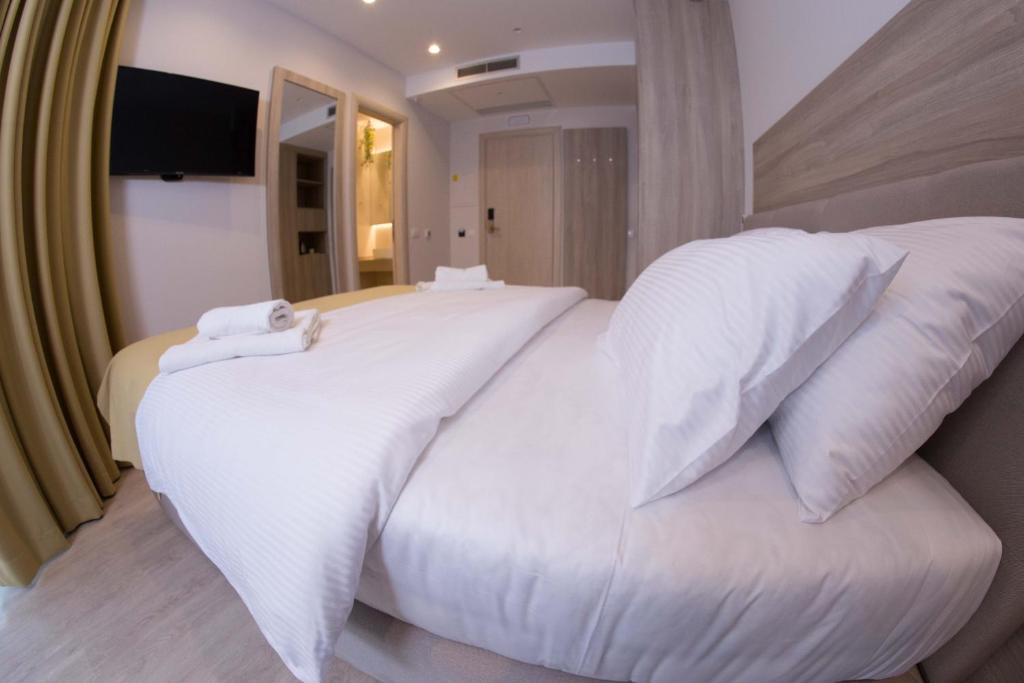 Postel nebo postele na pokoji v ubytování Hotel Verso