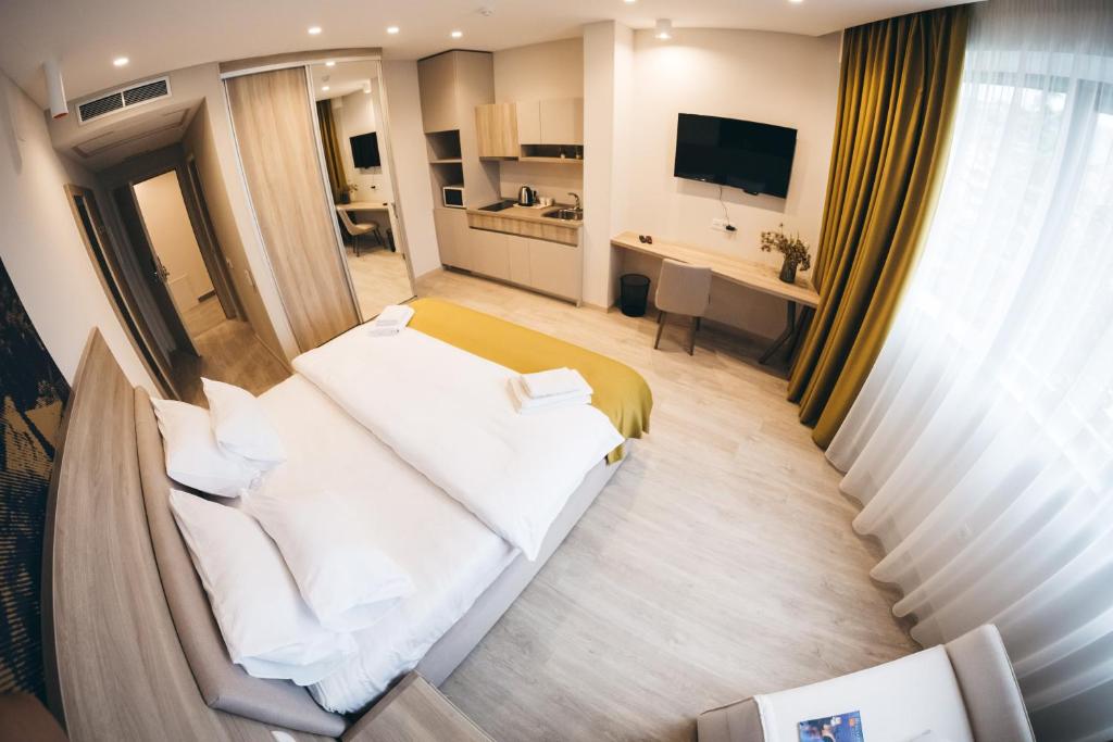 TV a/nebo společenská místnost v ubytování Hotel Verso