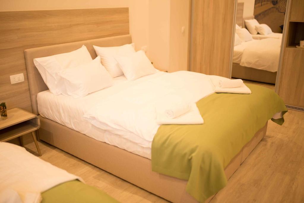 Postel nebo postele na pokoji v ubytování Hotel Verso