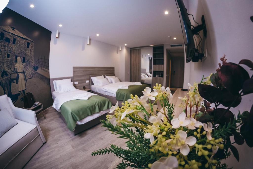 Postel nebo postele na pokoji v ubytování Hotel Verso