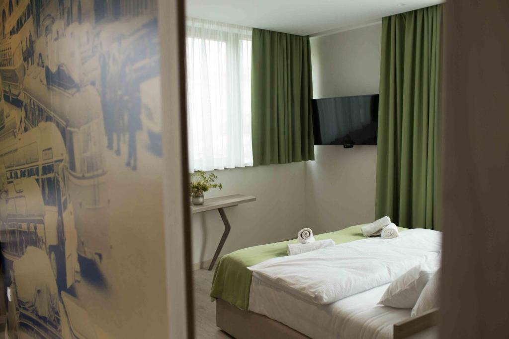 Postel nebo postele na pokoji v ubytování Hotel Verso